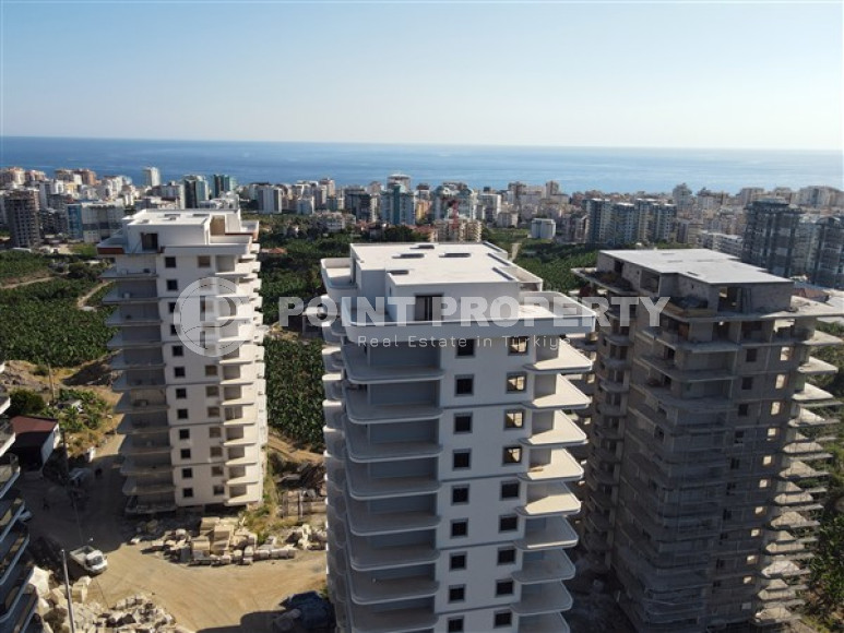 Three apartments with a 2+1 layout in a complex under construction, Mahmutlar district. The completion date of the work is August 2023.-id-4706-photo-10