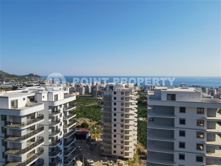 Three apartments with a 2+1 layout in a complex under construction, Mahmutlar district. The completion date of the work is August 2023.-id-4706-photo-11