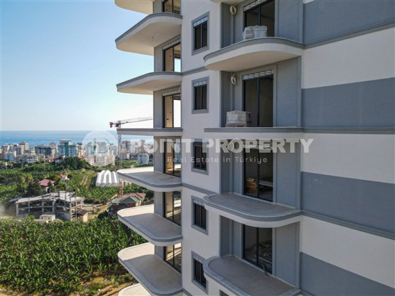 Three apartments with a 2+1 layout in a complex under construction, Mahmutlar district. The completion date of the work is August 2023.-id-4706-photo-12