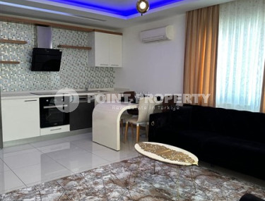 Modern two-room apartment with an area of 65 m2 and a balcony in the Mahmutlar area-id-4715-photo-4