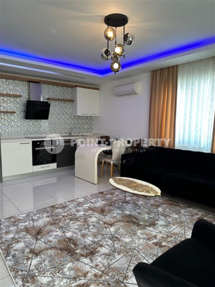 Modern two-room apartment with an area of 65 m2 and a balcony in the Mahmutlar area-id-4715-photo-4