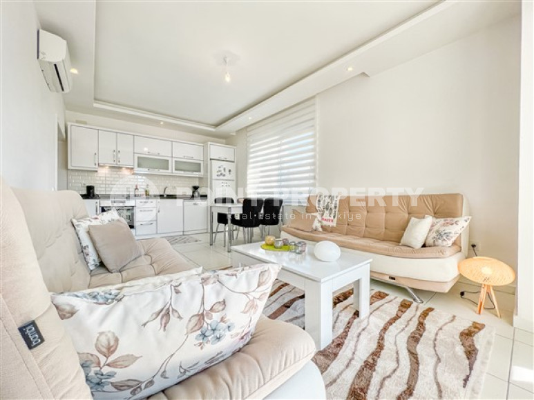 Comfortable furnished apartment 2+1 600 meters from the sea in the center of Mahmutlar-id-4752-photo-3