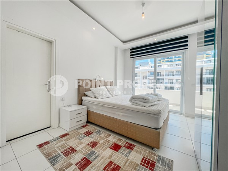 Comfortable furnished apartment 2+1 600 meters from the sea in the center of Mahmutlar-id-4752-photo-7