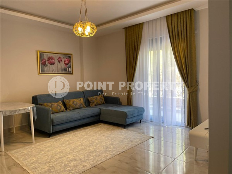Compact apartment 1+1, total area 55 m2, 500 meters from the sea in the center of Mahmutlar-id-4768-photo-2