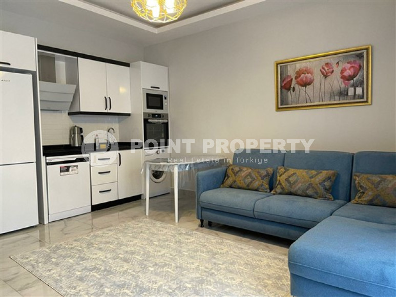 Compact apartment 1+1, total area 55 m2, 500 meters from the sea in the center of Mahmutlar-id-4768-photo-3