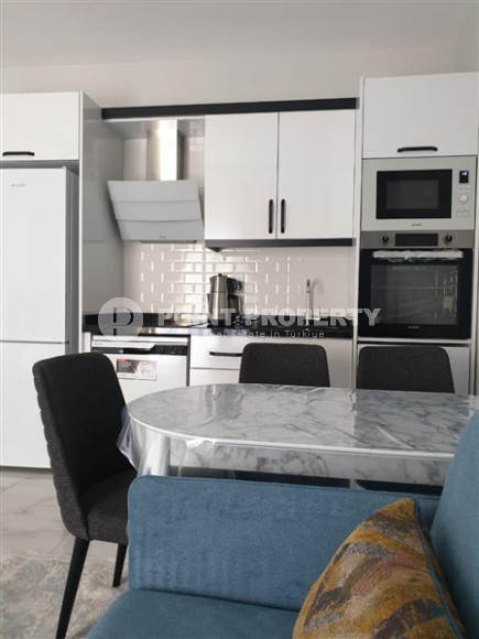 Compact apartment 1+1, total area 55 m2, 500 meters from the sea in the center of Mahmutlar-id-4768-photo-4