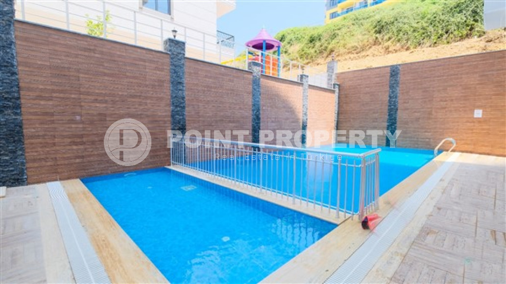 Compact apartment 1+1, total area 55 m2, 500 meters from the sea in the center of Mahmutlar-id-4768-photo-13