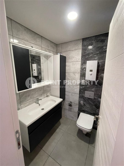 Inexpensive two-room apartment 60 m2 with a balcony and furniture, Mahmutlar district-id-4788-photo-6