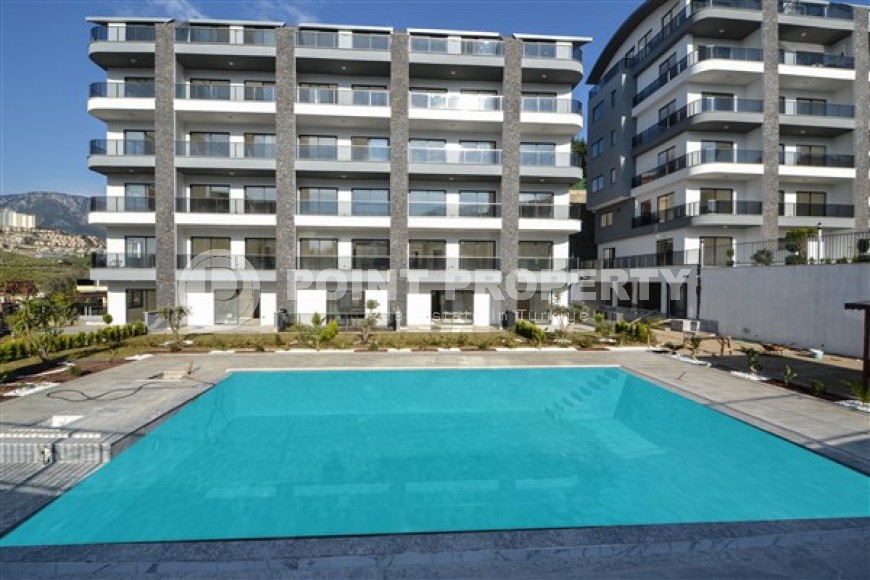 Apartment 1+1 with a balcony at the final finishing stage, Kargicak district-id-4810-photo-1