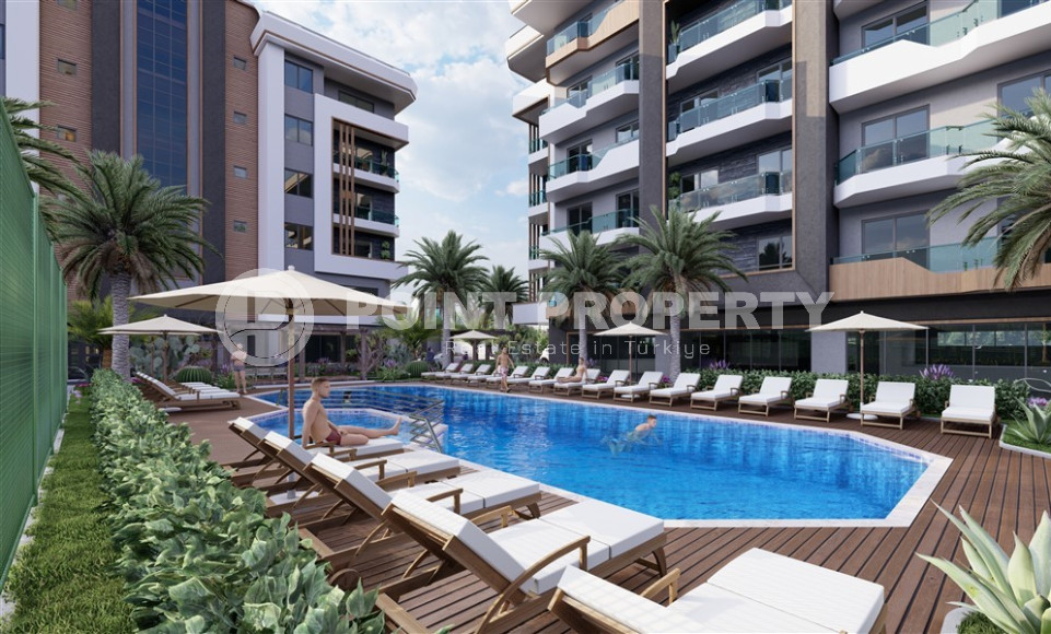 К продаже представлены комфортные апартаменты, начиная от уютно спланированных 1+1 до просторных дуплексов 3+1, в новейшем комплексе Окурджалара в 300 метрах от моря.-id-1051-фото-2