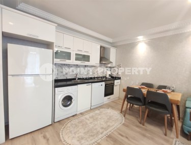 Меблированная квартира с двумя спальнями в 150 метрах от пляжа в центре популярного района Аланьи Махмутлар.-id-4222-фото-3