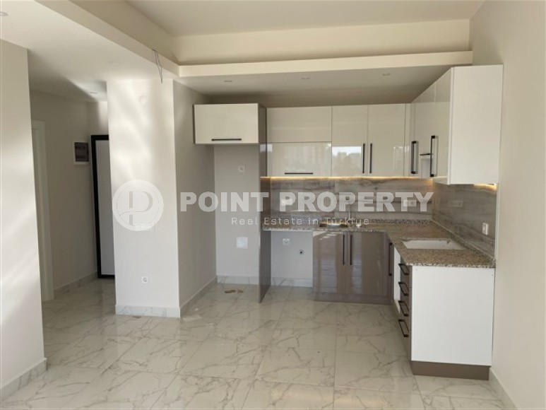 Новая квартира 1+1, общей площадью 55 м2, в 900 метрах от моря в районе Авсаллар-id-4929-фото-2