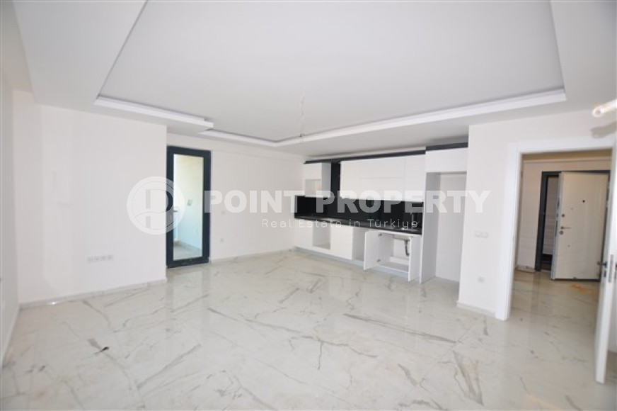 Ready to move in 1+1 apartment 76 m2 in a complex with excellent infrastructure, Mahmutlar-id-4970-photo-2