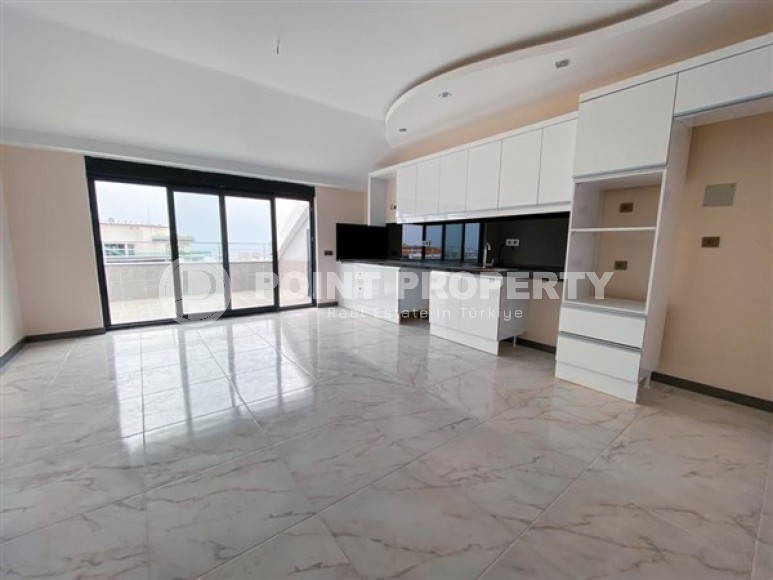 Просторная двухуровневая квартира с чистовой отделкой в 600 метрах от моря, в центре района Махмутлар-id-4993-фото-2