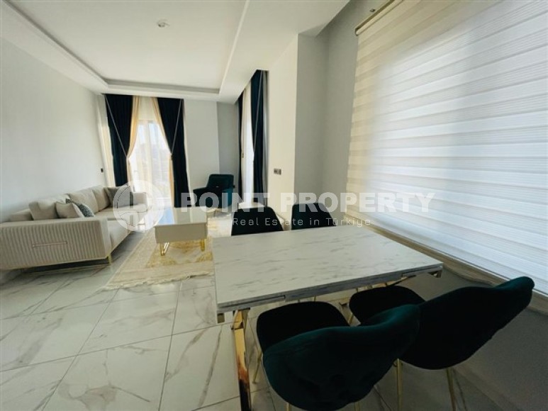 Двухуровневые апартаменты с тремя спальными комнатами в жилом комплексе 2023 года постройки, в районе Махмутлар-id-5079-фото-2