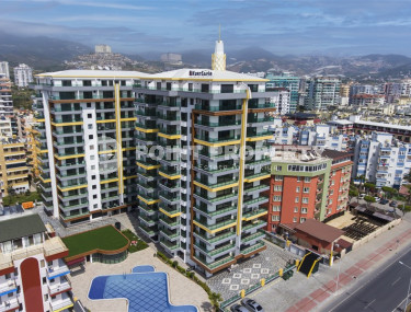 Apartment 1+1, 67m², in an elite complex on the first coastline in Mahmutlar, Alanya-id-1410-photo-1
