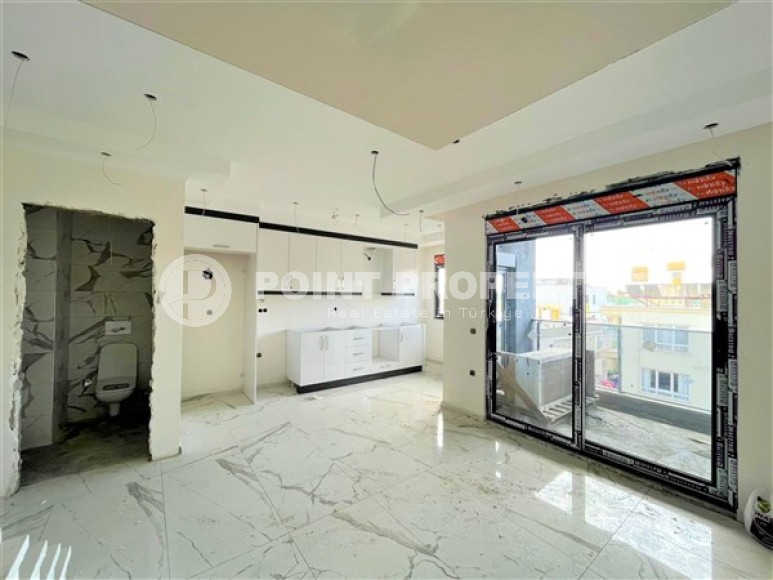 Двухуровневые апартаменты с двумя спальными комнатами в жилом комплексе на завершающем этапе строительства, в центре города Аланья-id-5129-фото-2