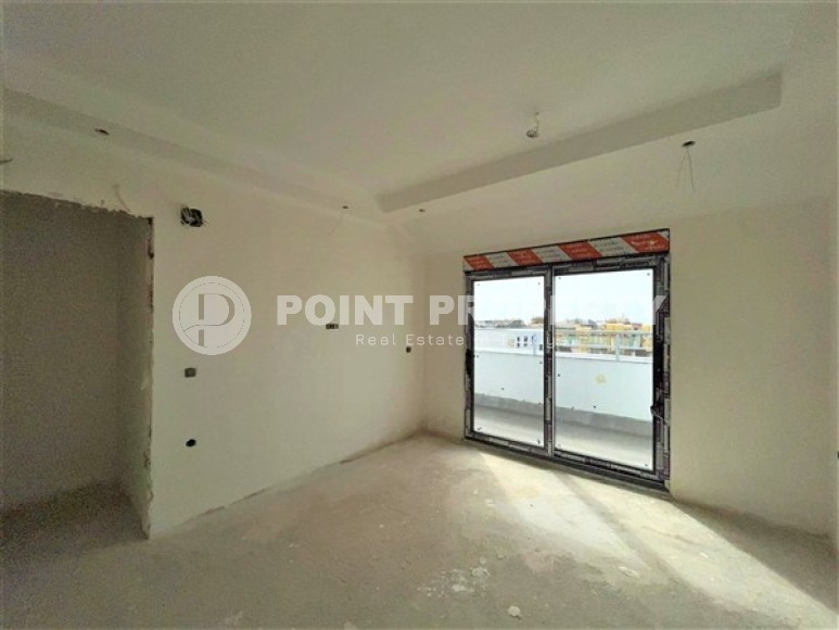 Двухуровневые апартаменты с двумя спальными комнатами в жилом комплексе на завершающем этапе строительства, в центре города Аланья-id-5129-фото-4