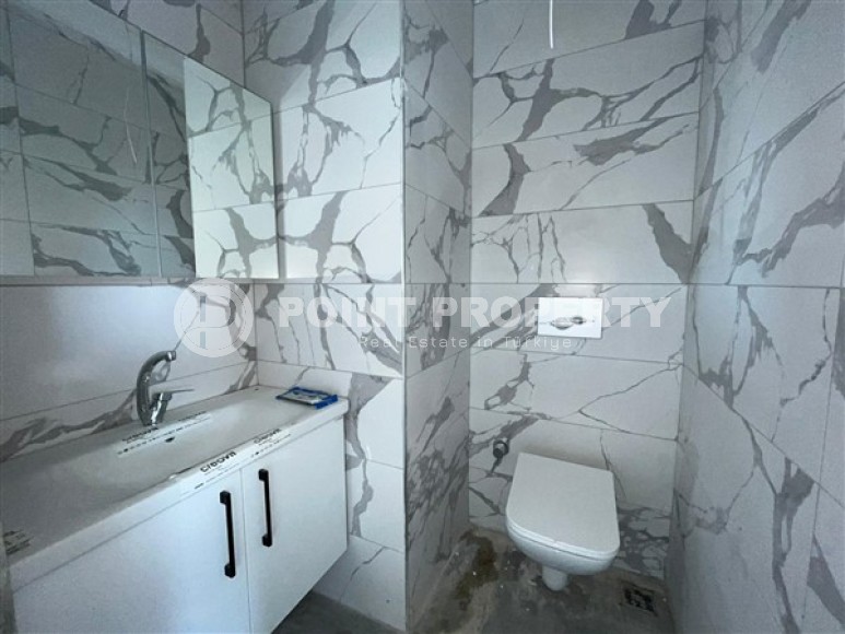 Двухуровневые апартаменты с двумя спальными комнатами в жилом комплексе на завершающем этапе строительства, в центре города Аланья-id-5129-фото-9