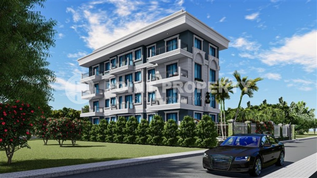 Квартиры 2+1 и дуплексы, общей площадью от 73 до 83 м2, в километре от моря в районе Демирташ-id-5307-фото-2