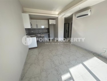 Небольшие не меблированные апартаменты с одной спальной комнатой, в районе Авсаллар-id-5314-фото-2