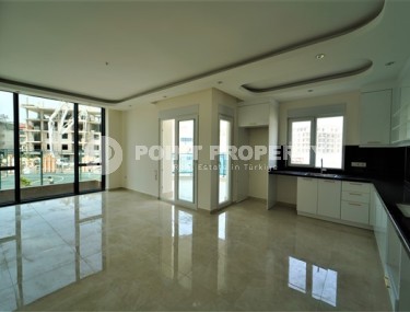 Новые светлые апартаменты с двумя спальными комнатами в современном жилом комплексе, в городе Газипаша-id-5316-фото-2