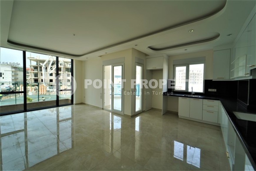 Новые светлые апартаменты с двумя спальными комнатами в современном жилом комплексе, в городе Газипаша-id-5316-фото-2