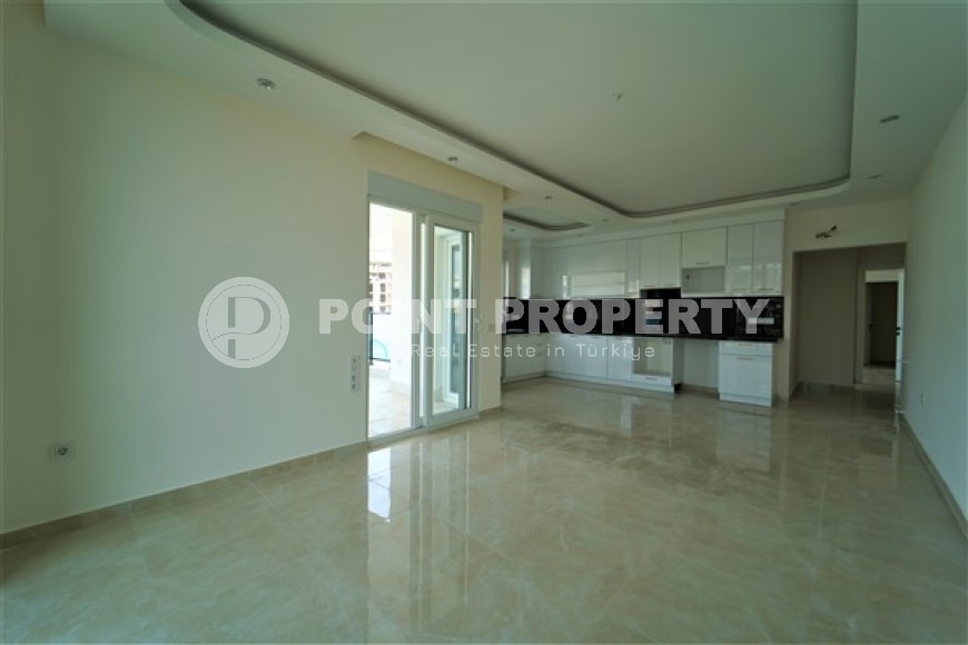 Новые светлые апартаменты с двумя спальными комнатами в современном жилом комплексе, в городе Газипаша-id-5316-фото-3