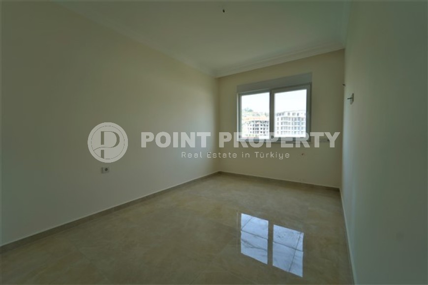 Новые светлые апартаменты с двумя спальными комнатами в современном жилом комплексе, в городе Газипаша-id-5316-фото-6