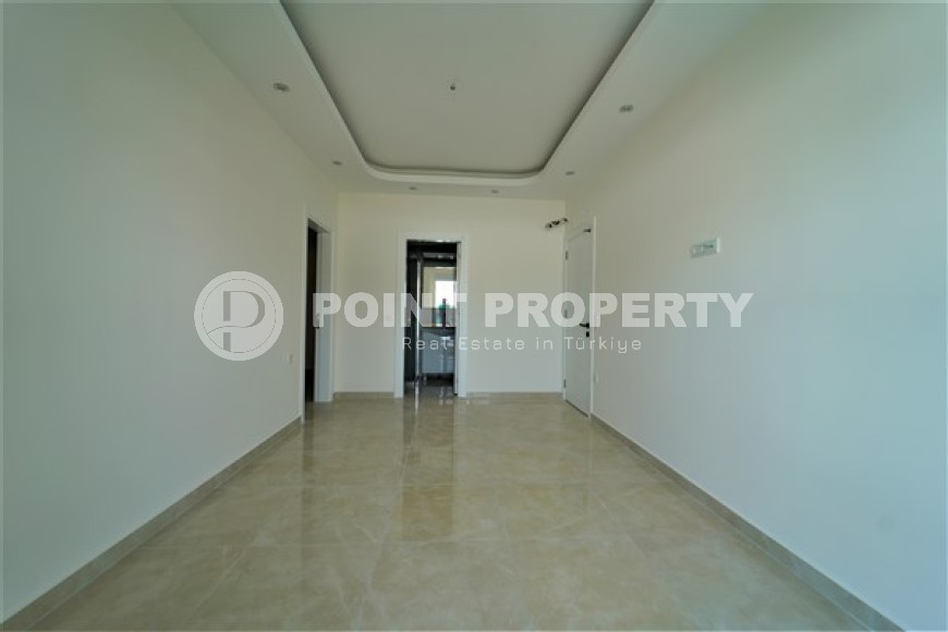 Новые светлые апартаменты с двумя спальными комнатами в современном жилом комплексе, в городе Газипаша-id-5316-фото-9