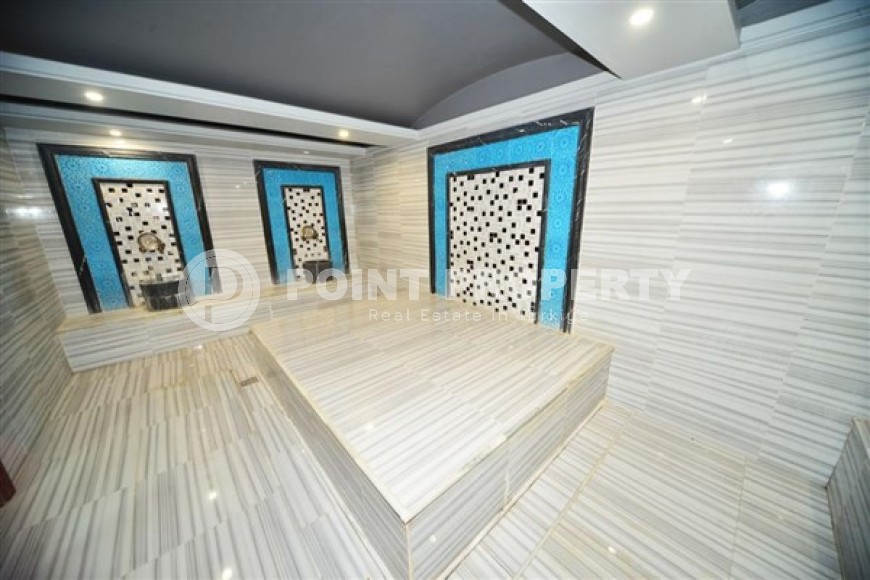 Апартаменты с мебелью и бытовой техникой на 4-м этаже в резиденции 2021 года постройки, в центре района Махмутлар-id-5318-фото-12