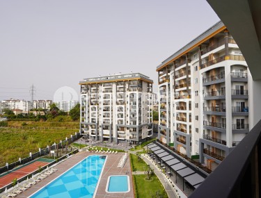 Светлые апартаменты с одной спальной комнатой, в чистовой отделке, в зеленом районе города Аланья - Авсаллар-id-5358-фото-1