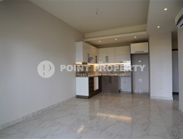 Светлые апартаменты с одной спальной комнатой, в чистовой отделке, в зеленом районе города Аланья - Авсаллар-id-5358-фото-2