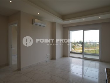 Светлые апартаменты с одной спальной комнатой, в чистовой отделке, в зеленом районе города Аланья - Авсаллар-id-5358-фото-3