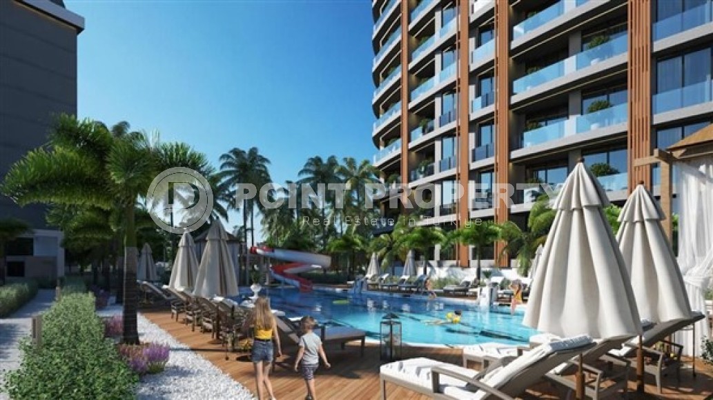 Апартаменты с одной спальной комнатой в жилом комплексе на завершающем этапе строительства, в районе города Аланья - Авсаллар-id-5362-фото-2