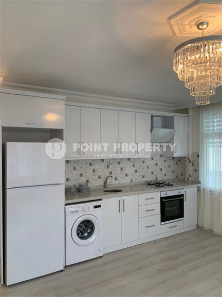 Бюджетная комфортабельная квартира 2+1 в центре района Тосмур и в 200 метрах от моря.-id-5392-фото-3