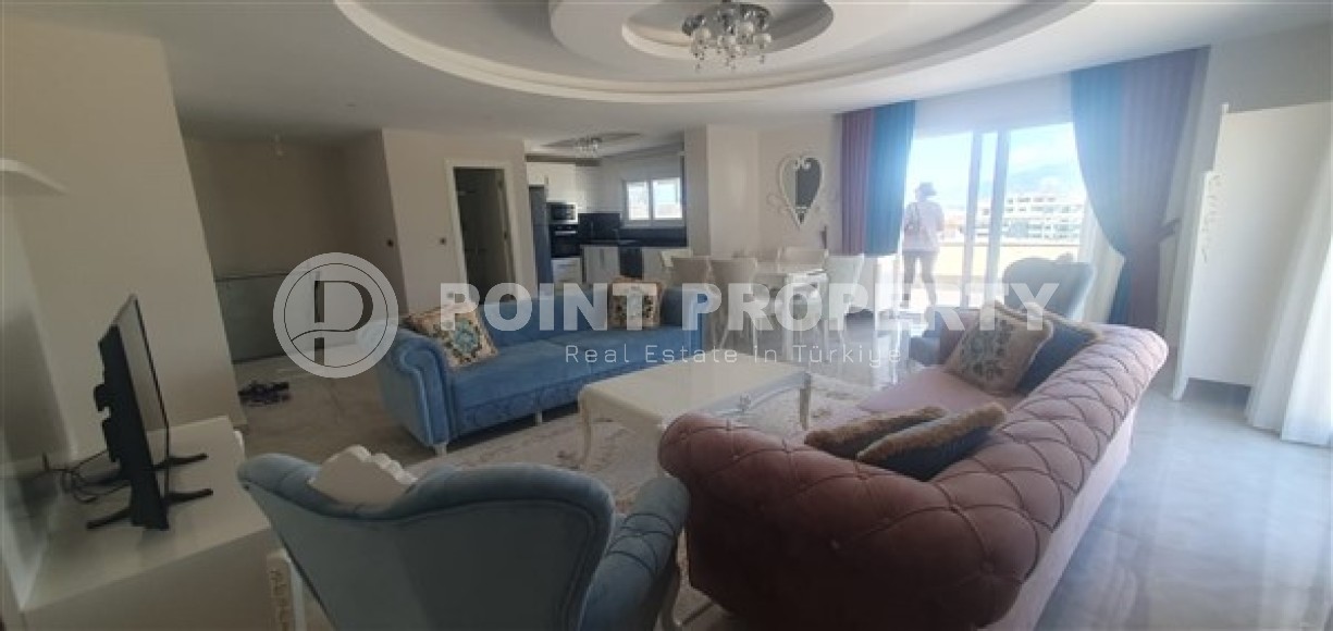 Светлые двухуровневые апартаменты с тремя спальными комнатами и видовой террасой на Торосские горы, в районе Махмутлар-id-5406-фото-2