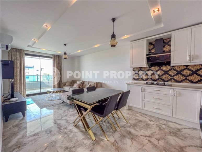 Стильные меблированные апартаменты, планировкой 1+1, рядом с морем в районе Каргыджак-id-5411-фото-3