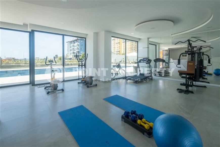 Стильные меблированные апартаменты, планировкой 1+1, рядом с морем в районе Каргыджак-id-5411-фото-12