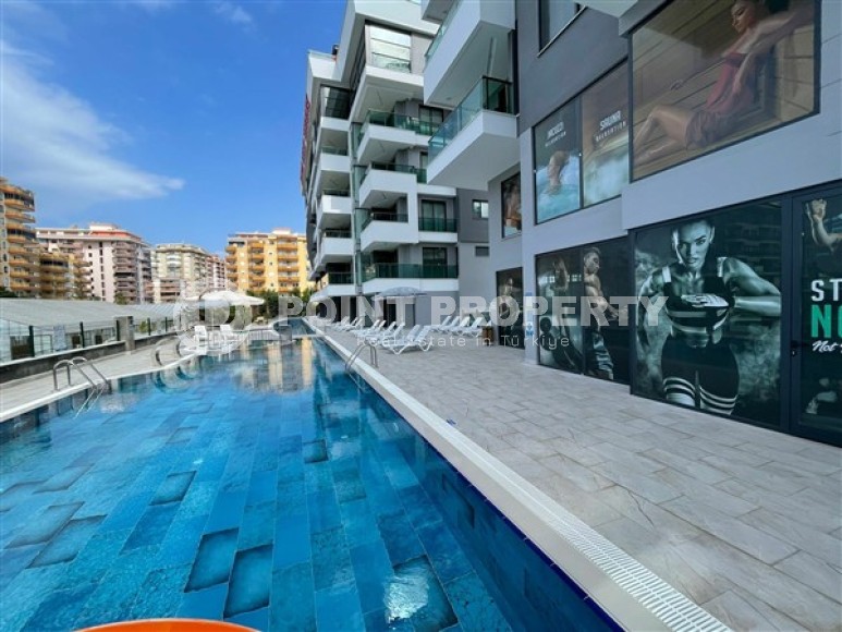 Стильные меблированные апартаменты, планировкой 1+1, рядом с морем в районе Каргыджак-id-5411-фото-15