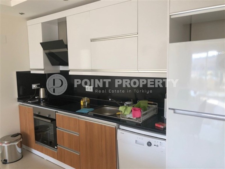 Panoramic apartment 1+1, with a total area of 70 m2, on the 11th floor in the center of Mahmutlar district-id-5422-photo-2