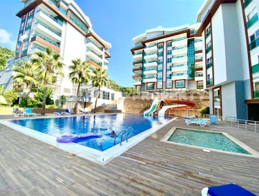 Стильная современная квартира 1+1, общей площадью 65 м2, в 400 метрах от моря в спокойном районе Аланьи - Каргыджак-id-5462-фото-1