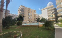 Partially furnished apartment with three bedrooms, in a well-maintained residential complex on the first coastline from the Mediterranean Sea, in the Mahmutlar area-id-5478-photo-1