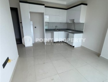 Небольшие апартаменты в чистовой отделке, планировкой 1+1, в районе Махмутлар-id-5485-фото-2