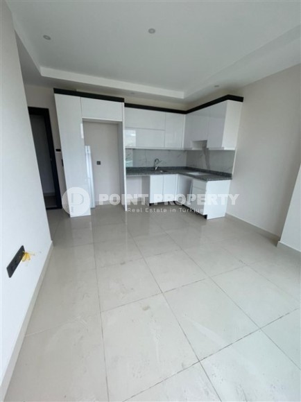 Небольшие апартаменты в чистовой отделке, планировкой 1+1, в районе Махмутлар-id-5485-фото-2