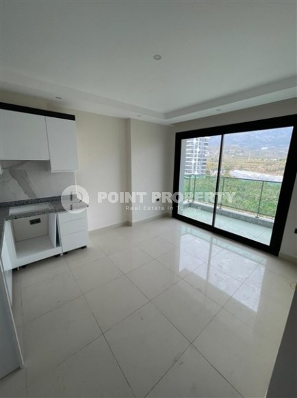 Небольшие апартаменты в чистовой отделке, планировкой 1+1, в районе Махмутлар-id-5485-фото-3