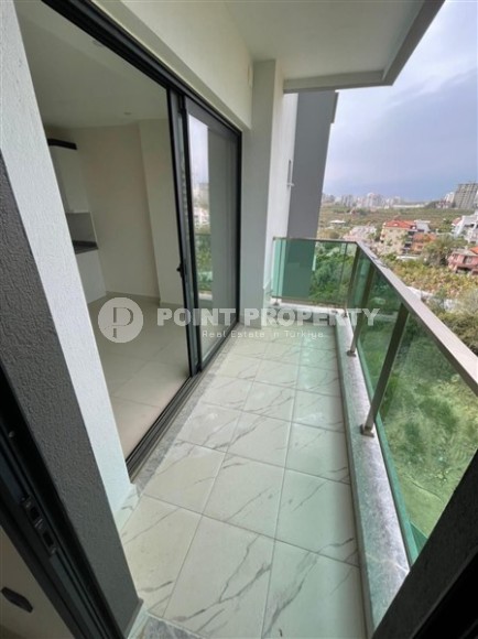 Небольшие апартаменты в чистовой отделке, планировкой 1+1, в районе Махмутлар-id-5485-фото-9