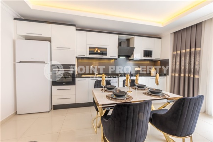 Апартаменты с новым ремонтом, стильным современным дизайном, мебелью и бытовой техникой, в центре спокойного, благоустроенного района Аланьи - Тосмур-id-5499-фото-4