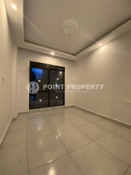 Апартаменты с чистовой отделкой в перспективном, активно развивающемся районе Аланьи - Авсаллар-id-5587-фото-3