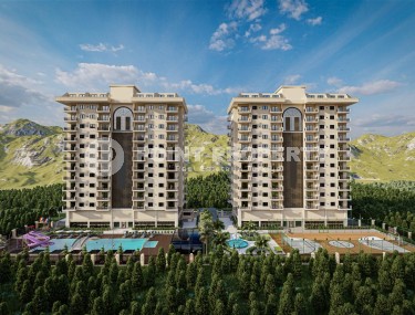 A new large-scale project - a residential complex with 176 apartments, 750 meters from the sea, in the center of Mahmutlar district-id-5589-photo-1